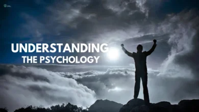 Silhouette of a person raising fists on a mountain with 'Understanding the Psychology' text