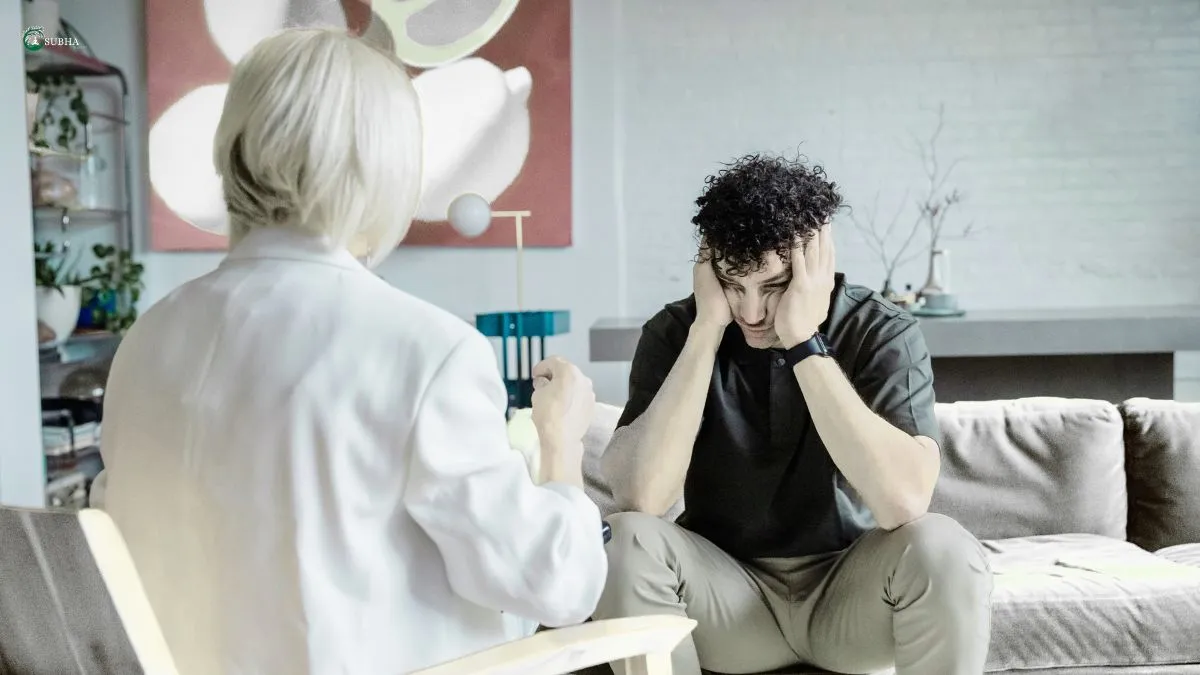 A distressed man in a therapy session expressing emotions to a counselor, symbolizing the role of therapy in emotional release.