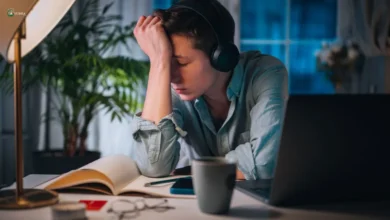 Stressed person experiencing workplace burnout at night