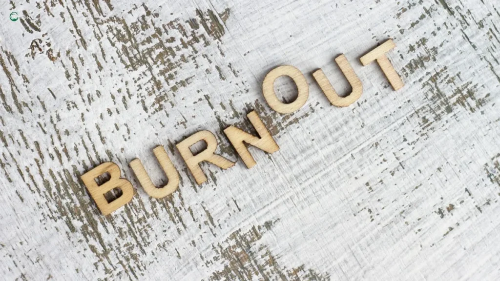 Burnout spelled in wooden letters on rustic background.