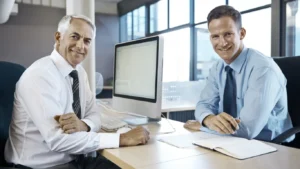Businessmen discussing mental health myths and AI solutions in office