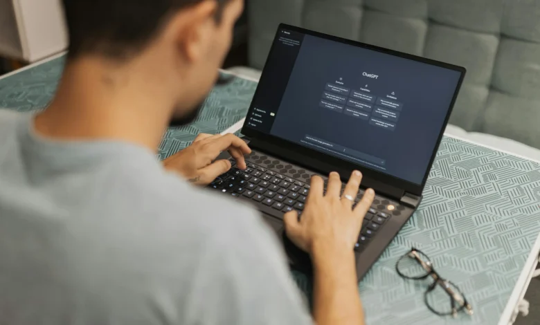 Person using an AI chatbot on laptop – concept of AI Chatbots vs Therapists in mental health support.
